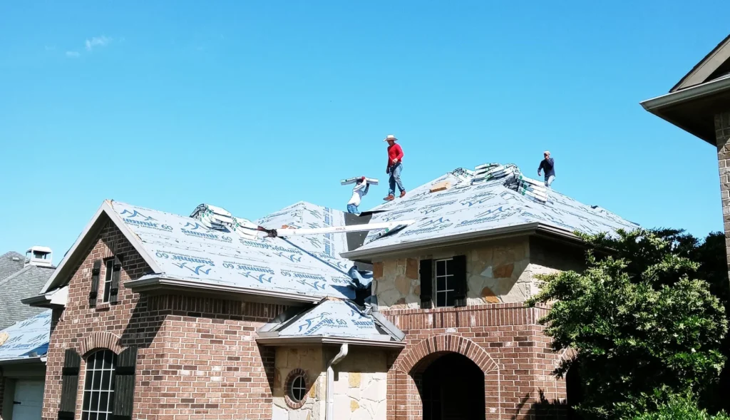 Roofers working on a residential roof